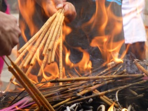 Burning incense at Lama Temple